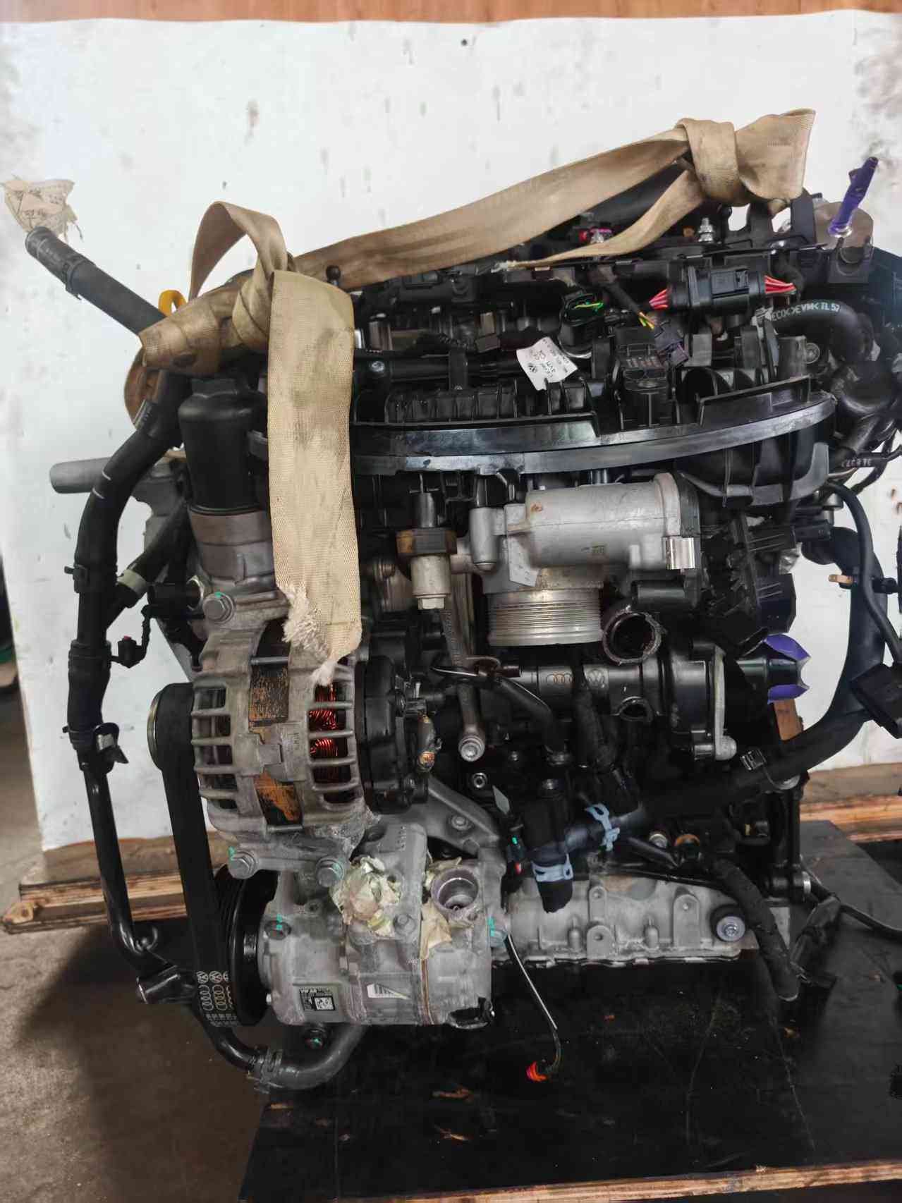 Volkswagen EA888 Gen 3 CHH engine intake-side view showing intake manifold, alternator, throttle body, and coolant connections.