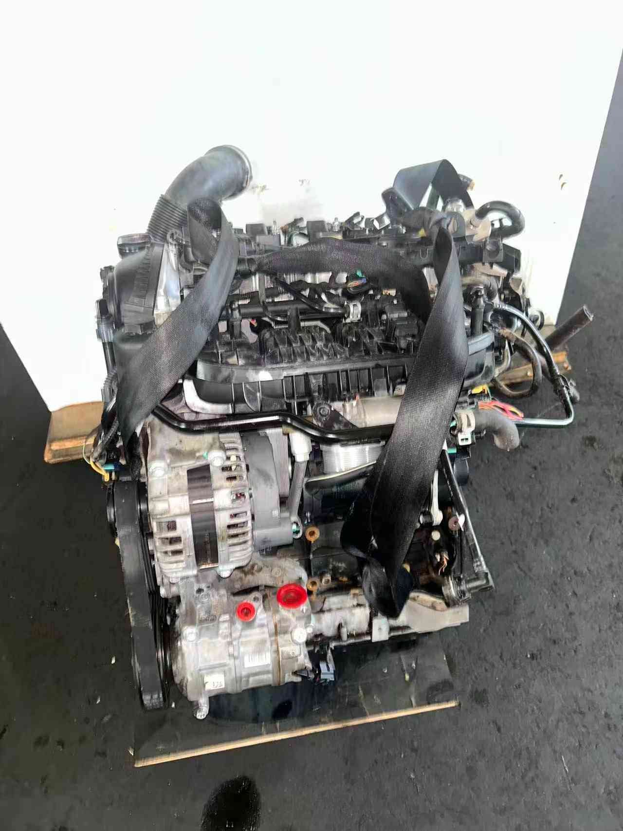 Accessory-side view of a Volkswagen EA888 Gen 3 CJE engine showing alternator, air-conditioning compressor, intake manifold, and engine wiring.
