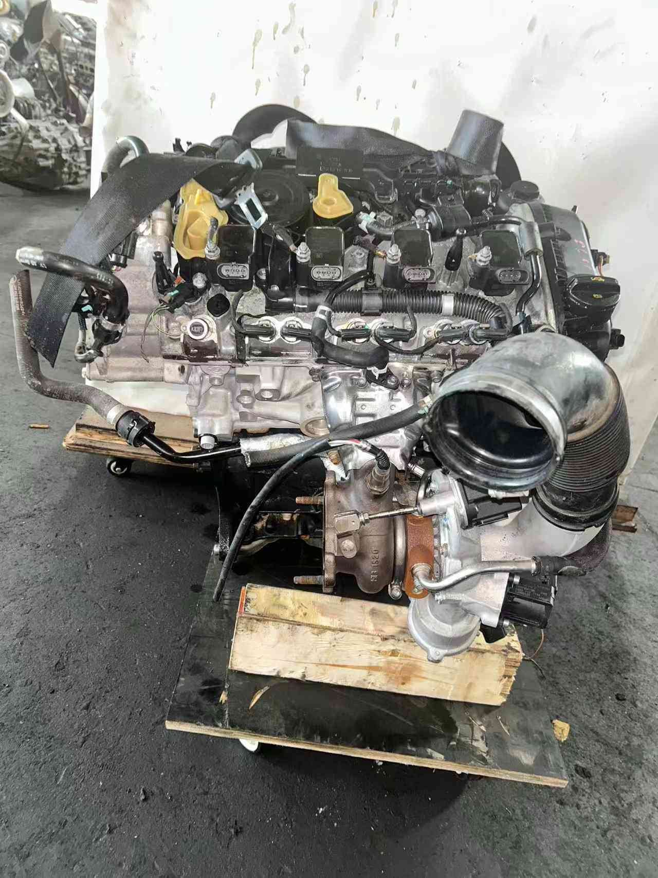 Volkswagen EA888 Gen 3 CJE engine turbocharger-side view with large intake duct, turbo housing, and fuel-system components.